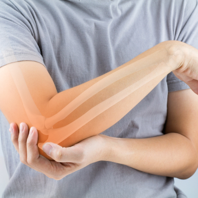 A close-up shot of a man holding his elbow illustrates Osteoporosis.